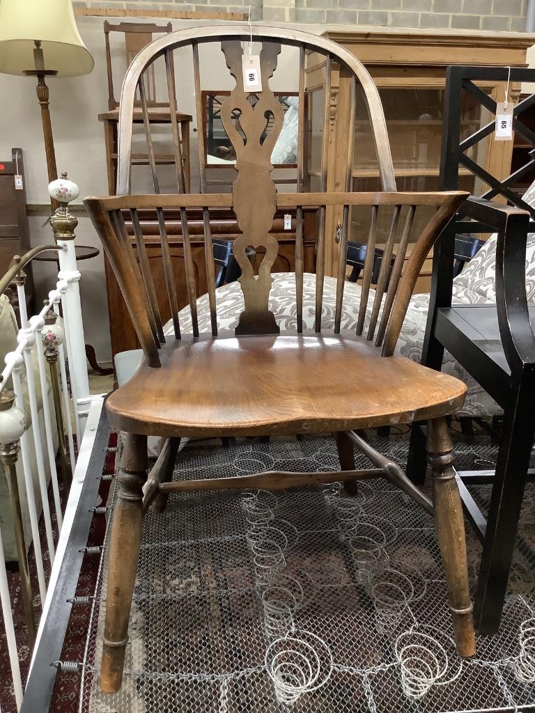 An early 20th century elm and beech Windsor comb back elbow chair, width 52cm, depth 50cm, height 98cm